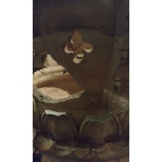 Pottery stand with perforation and lotus petal design, cross